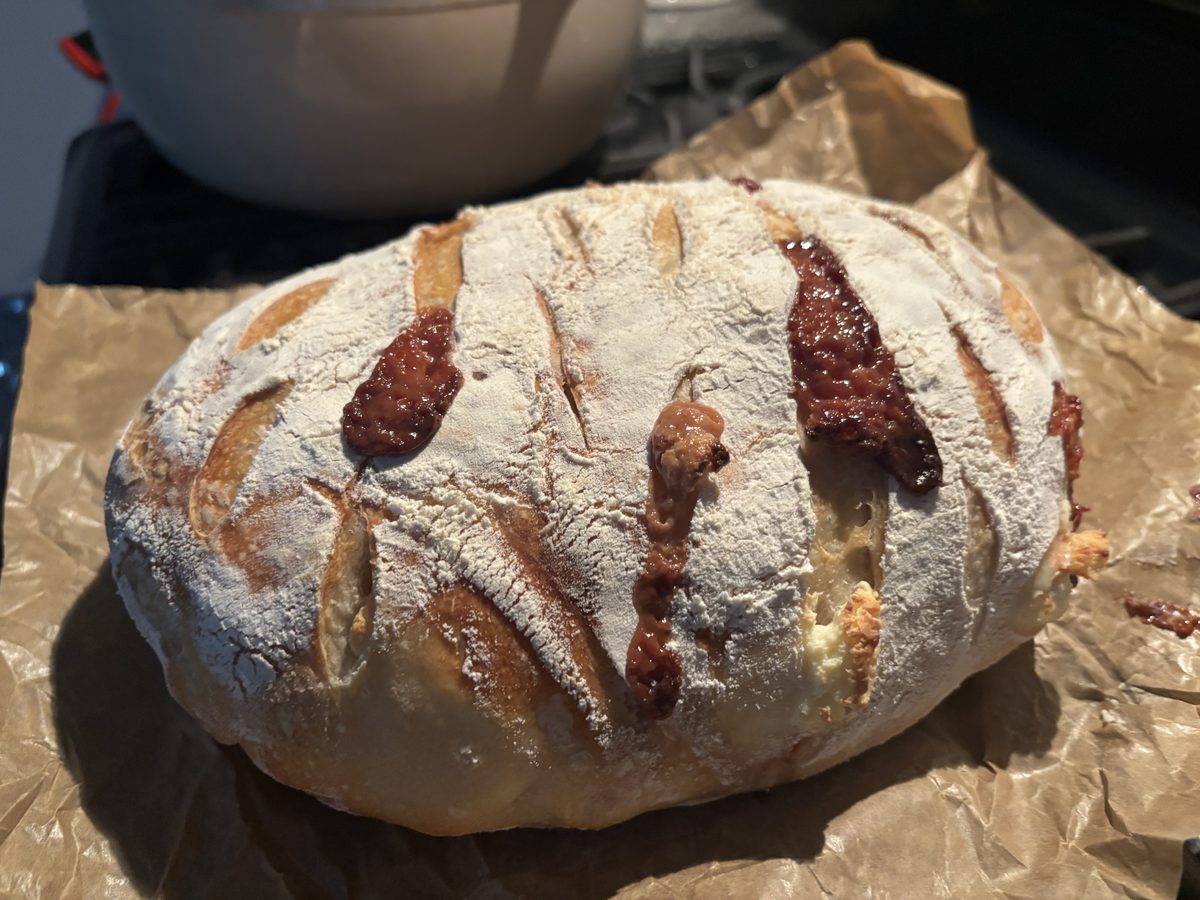 Guava cream cheese sourdough with guava filling oozing from score marks